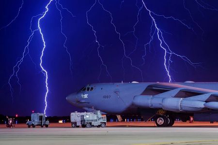 FILE PHOTO: Lightning strikes behind a B-52H Stratofortress at Minot Air Force Base, North Dakota, U.S. on August 8, 2017. Courtesy J.T. Armstrong/U.S. Air Force photo/Handout via REUTERS ATTENTION EDITORS - THIS IMAGE HAS BEEN SUPPLIED BY A THIRD PARTY./File Photo