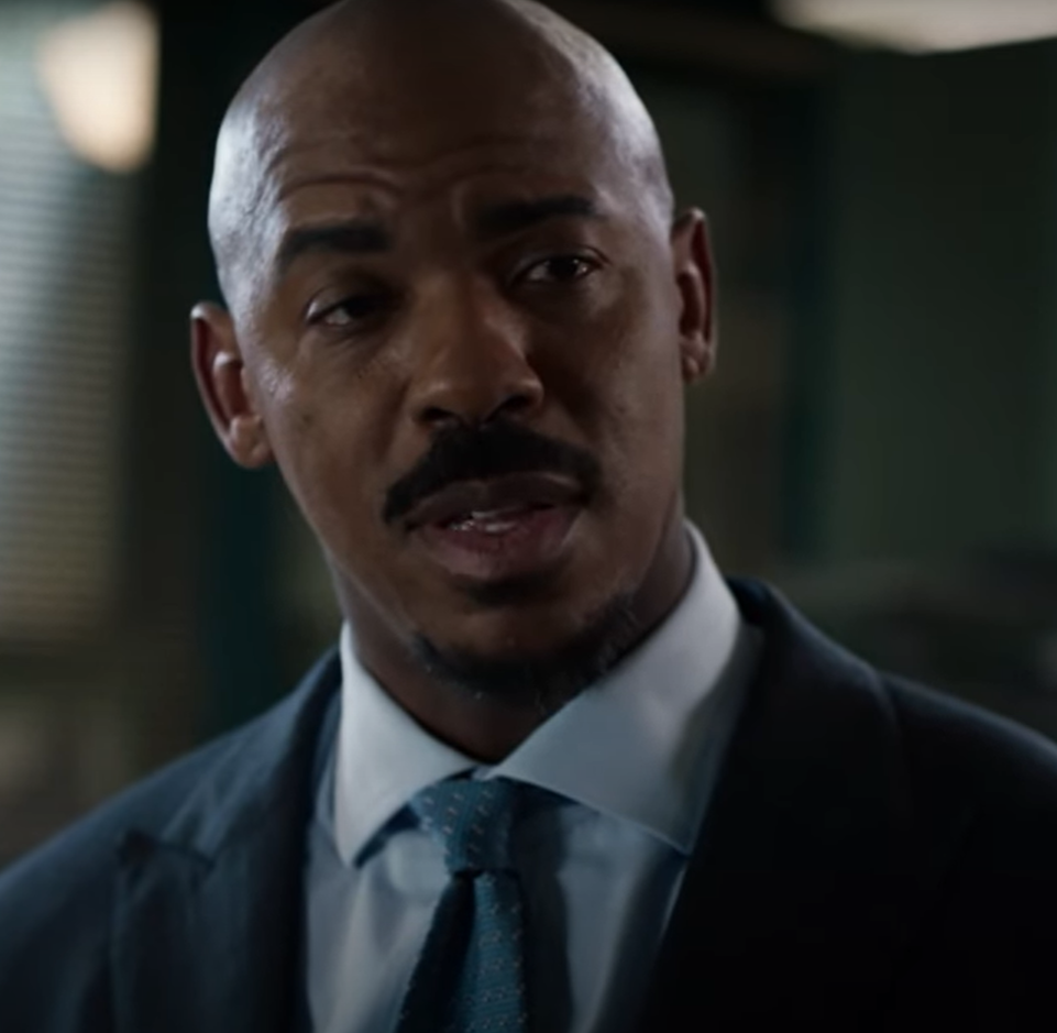 Mehcad Brooks wears a suit and tie in his role on Law & Order