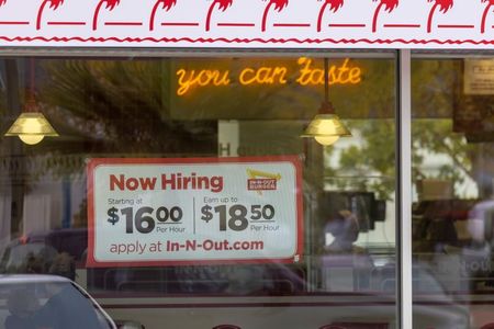 An In-N-Out Burger advertises for workers at their restaurants location in Encinitas, California, U.S., May 10, 2021. REUTERS/Mike Blake