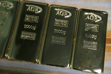 Gold bars weighing 1kg are seen at AGR (African Gold Refinery) in Entebbe, Uganda, October 4, 2018. Picture taken October 4, 2018. To match Insight AFRICA-GOLD/REFINERIES REUTERS/Baz Ratner