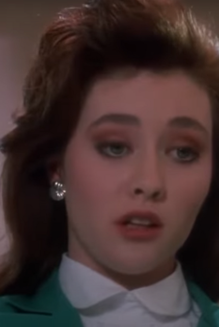 Shannen Doherty plays as Heather Duke in the '80s cult classic film, Heathers, about a group of clique popular girls named Heather.