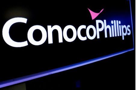 The logo for ConocoPhillips is displayed on a screen on the floor at the New York Stock Exchange (NYSE) in New York, U.S., January 13, 2020. REUTERS/Brendan McDermid
