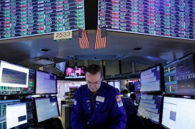 A trader works on the trading floor at the New York Stock Exchange (NYSE) in Manhattan, New York City, U.S., August 5, 2021. REUTERS/Andrew Kelly