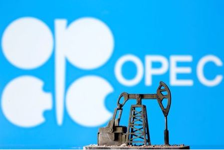 A 3D printed oil pump jack is seen in front of displayed Opec logo in this illustration picture, April 14, 2020. REUTERS/Dado Ruvic/Illustration