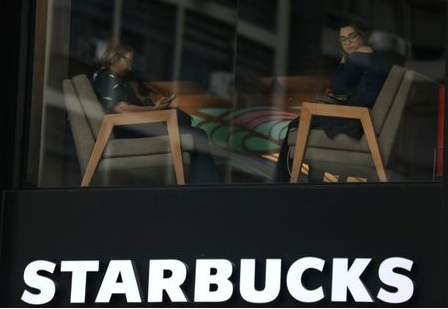 Customers sit inside a Starbucks coffee shop in Rio de Janeiro, Brazil August 15, 2018. REUTERS/Pilar Olivares