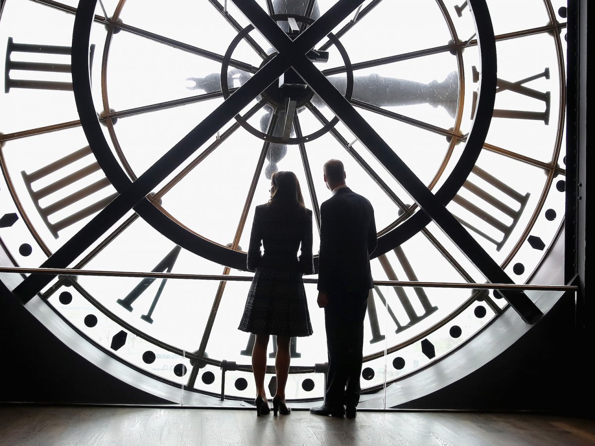 The next day, she and William were in Paris, and enjoyed a quiet moment looking out over Paris from behind the clock face of the city's Musee D'Orsay.