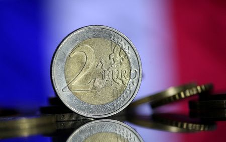 FILE PHOTO: Euro coins are seen in front of displayed France flag in this picture illustration taken May 7, 2017. REUTERS/Dado Ruvic/Illustration/File Photo 