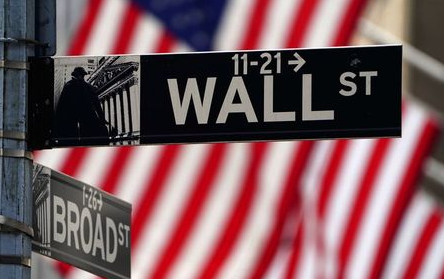 A Wall Street sign is pictured outside the New York Stock Exchange amid the coronavirus disease (COVID-19) pandemic in the Manhattan borough of New York City, New York, U.S., April 16, 2021. REUTERS/Carlo Allegri