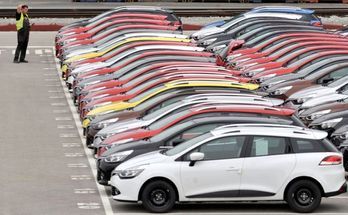 Renault cars produced in Turkey and awaiting export throughout Europe, are checked by a worker in the port of Koper October 14, 2013. Automotive industry association ACEA said October 16, 2013, that new car registrations in Europe climbed 5.5 percent to 1.19 million vehicles in September, only the third month a gain was recorded in the past two years. But within the European Union, the level of demand was the second lowest on record for the month of September since it began tabulating results for the 27 member states in 2003. Picture taken October 14. REUTERS/Srdjan Zivulovic (SLOVENIA - Tags: TRANSPORT BUSINESS)