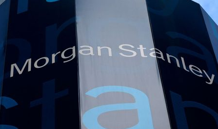 The corporate logo of financial firm Morgan Stanley is pictured on the company's world headquarters in the Manhattan borough of New York City, January 20, 2015. Wall Street investment bank Morgan Stanley said it would pay a smaller portion of revenue in bonuses to its bankers and traders this year even in a better revenue environment. The bank reported a drop in fourth-quarter adjusted earnings, missing estimates, as it deferred fewer bonus payouts and unexpected market swings hit its division that trades bonds, currencies and commodities. REUTERS/Mike Segar (UNITED STATES - Tags: BUSINESS LOGO)