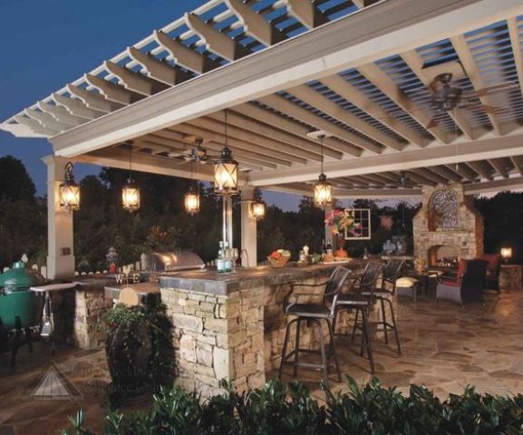 03 cozy lanterns hanging from the pergola above the kitchen