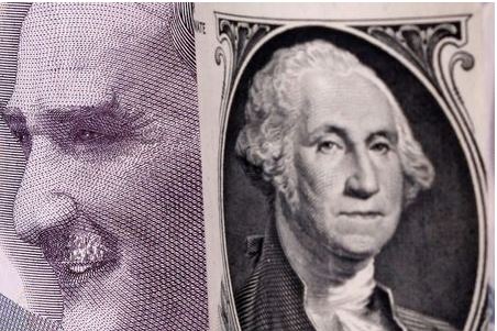 Turkish lira and U.S. dollar banknotes are seen in this illustration taken January 6, 2020. REUTERS/Dado Ruvic/Illustration