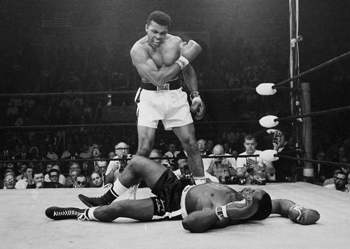 Heavyweight Champion Muhammad Ali Stands Over Fallen Challenger Sonny Liston, Shouting And Gesturing Shortly After Dropping Liston With A Short Hard Right To The Jaw On May 25, 1965, In Lewiston, Maine. The Bout Lasted Only One Minute Into The First Round.