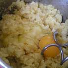 Снять с огня и по одному добавить в тесто яйца, тщательно вымешивая после каждой добавки... 
