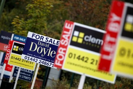 Estate agents' boards are displayed, amid the spread of the coronavirus disease (COVID-19), in Apsley, Hertfordshire, Britain, October 12, 2020. REUTERS/Matthew Childs