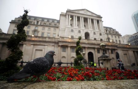 FILE PHOTO: A pigeon stands in front of the Bank of England in London, Britain, April 9, 2018. Picture taken April 9, 2018. REUTERS/Hannah McKay
