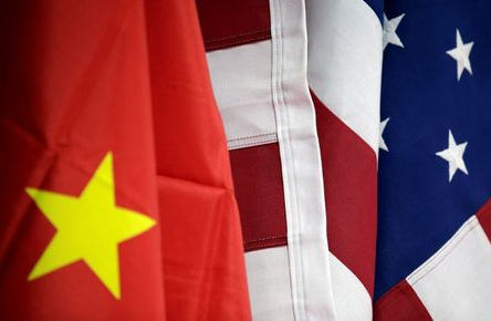 Flags of U.S. and China are displayed at American International Chamber of Commerce (AICC)'s booth during China International Fair for Trade in Services in Beijing, China, May 28, 2019. REUTERS/Jason Lee