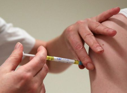 A volunteer receives a dose of CureVac vaccine or a placebo during a study by the German biotech firm CureVac as part of a testing for a new vaccine against the coronavirus disease (COVID-19), in Brussels, Belgium March 2, 2021. REUTERS/Yves Herman