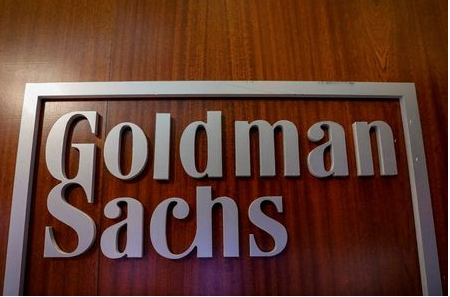 FILE PHOTO: The Goldman Sachs company logo is seen in the company's space on the floor of the New York Stock Exchange, (NYSE) in New York, U.S., April 17, 2018. REUTERS/Brendan McDermid/File Photo