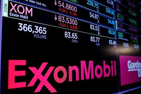 A logo of Exxon Mobil is displayed on a monitor above the floor of the New York Stock Exchange shortly after the opening bell in New York, U.S., December 5, 2017. REUTERS/Lucas Jackson