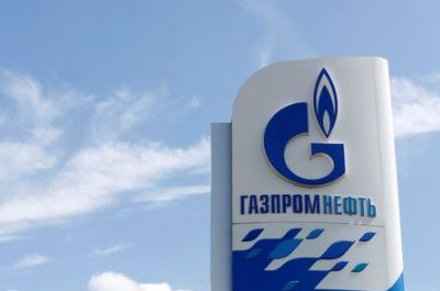 A board with the logo of Gazprom Neft oil company is on display at a fuel station in Moscow, Russia, May 30, 2016. REUTERS/Maxim Zmeyev