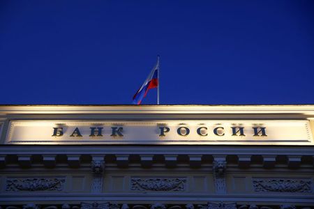 A Russian state flag flies over the Central Bank headquarters in Moscow, Russia March 29, 2021. A sign reads: "Bank of Russia". REUTERS/Maxim Shemetov