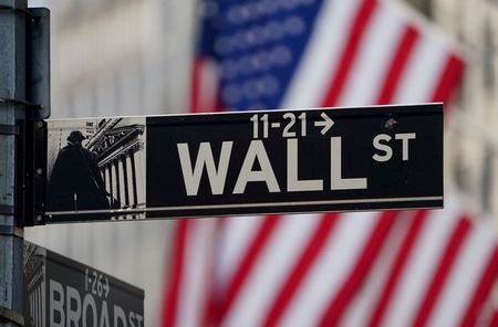 The Wall Street sign is pictured at the New York Stock exchange (NYSE) in the Manhattan borough of New York City, New York, U.S., March 9, 2020. REUTERS/Carlo Allegri/File Photo