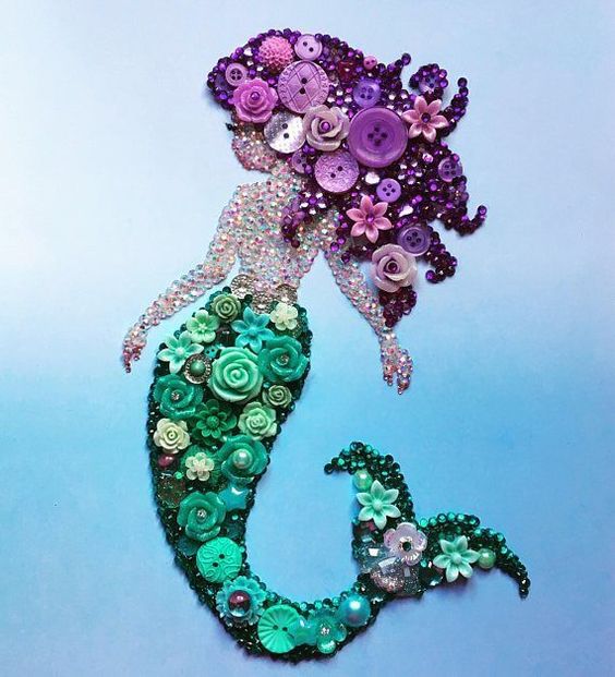 How gorgeous is this mermaid!!?? It would be a stunning unique gift for someone special or yourself! The background is a blue ombré effect and the mermaid herself is made from Buttons, resin flowers, pearls and diamantes in purple and teal - all individually hand placed. She is just #artsandcraftsgifts, #outdoordiygifts