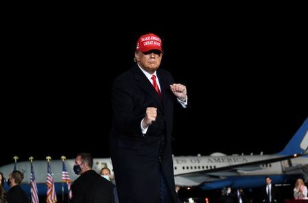 U.S. President Donald Trump dance as he leaves a campaign rally, in Rome, Georgia, U.S., November 1, 2020. Picture taken November 1, 2020. REUTERS/Brandon Bell