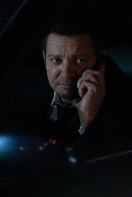 Mike McLusky talks on the phone with Iris as he warns her that Konstantin is there
