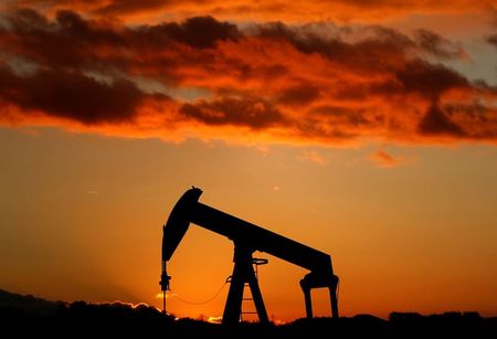 FILE PHOTO: A oil pump is seen at sunset outside Scheibenhard, near Strasbourg, France, October 6, 2017. REUTERS/Christian Hartmann/File Photo