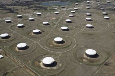FILE PHOTO: Crude oil storage tanks are seen from above at the Cushing oil hub, in Cushing, Oklahoma, March 24, 2016. Picture taken March 24, 2016. REUTERS/Nick Oxford//File Photo