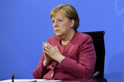 FILE PHOTO: German Chancellor Angela Merkel attends a news conference after a coronavirus disease (COVID-19) vaccination summit of the federal and state governments at the Chancellery in Berlin, Germany May 27, 2021. REUTERS/Annegret Hilse/Pool