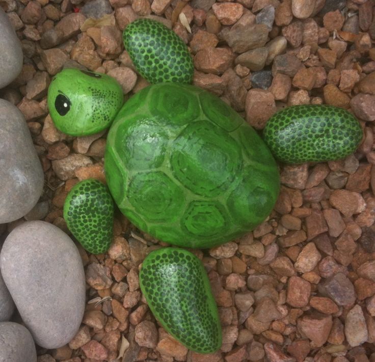 Turtle painted on river rocks. I made this to sit next to my painted faux koi pond.