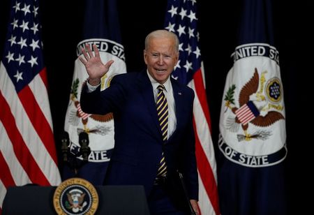 U.S. President Joe Biden waves after speaking to State Department staff during a visit by Biden at the State Department in Washington, U.S., February 4, 2021. REUTERS/Tom Brenner