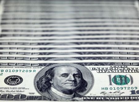 U.S. dollar notes are seen in this picture illustration taken at the Bank of Taiwan in Taipei November 11, 2010. U.S. Treasury Secretary Timothy Geithner insisted on Thursday that Washington would never resort to weakening the dollar to spur growth, seeking to cool tensions as G20 nations struggled to bridge chasms over currencies. REUTERS/Nicky Loh (TAIWAN - Tags: BUSINESS)