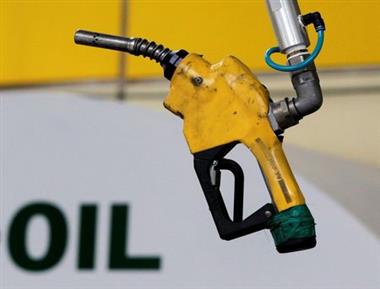 A gas pump is seen hanging from the ceiling at a petrol station in Seoul, South Korea, June 27, 2011. REUTERS/Jo Yong-Hak/File Photo 