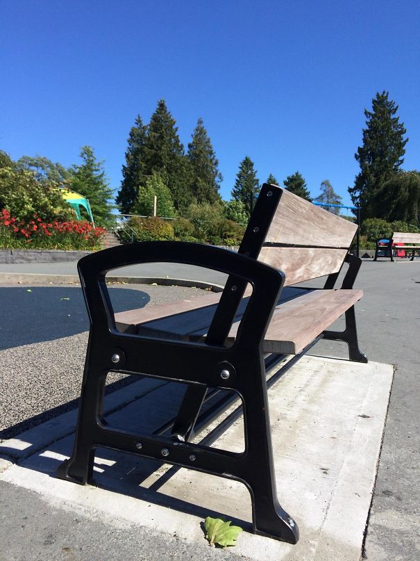 The Back Of This Park Bench Can Swing Back And Forth, Allowing The User To Face Either Direction