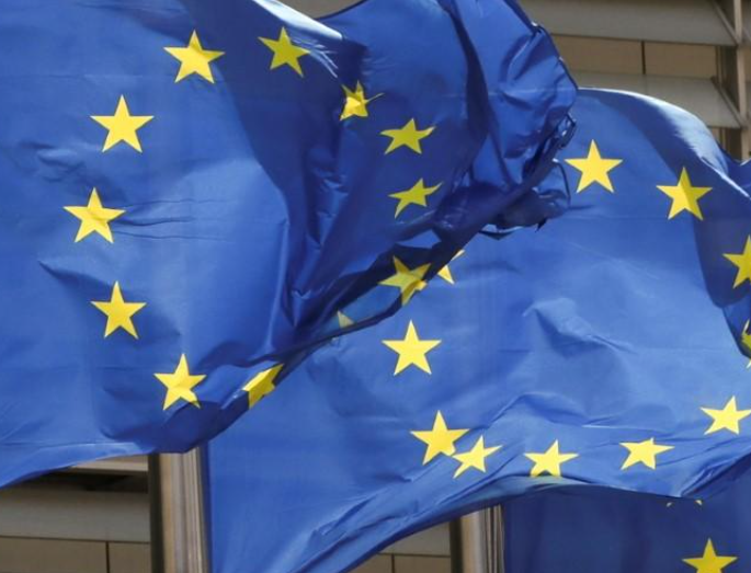 FILE PHOTO: European Union flags flutter outside the EU Commission headquarters in Brussels, Belgium May 5, 2021. REUTERS/Yves Herman/File Photo