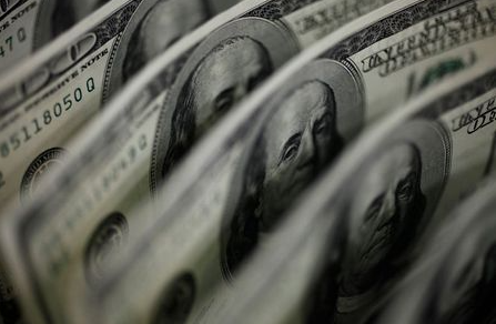 A picture illustration shows U.S. 100 dollar bank notes taken in Tokyo August 2, 2011. The Swiss franc rose to a record high against the euro and was close to a record versus the dollar on Tuesday as concerns about euro zone sovereign debt problems and a slowdown in the global economy buoyed demand for the safe-haven currency. REUTERS/Yuriko Nakao (JAPAN - Tags: BUSINESS POLITICS)